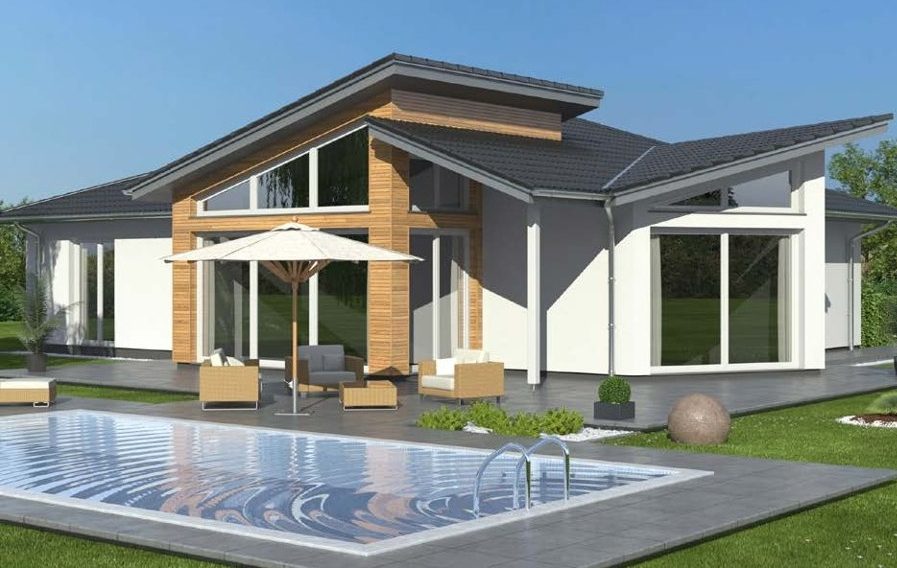 Der Hausbau Berater - Drevo Fertighaus Berater - Thomas Bärtle Moderne Villa mit Flachdach, großer Terrasse und Pool im Garten.